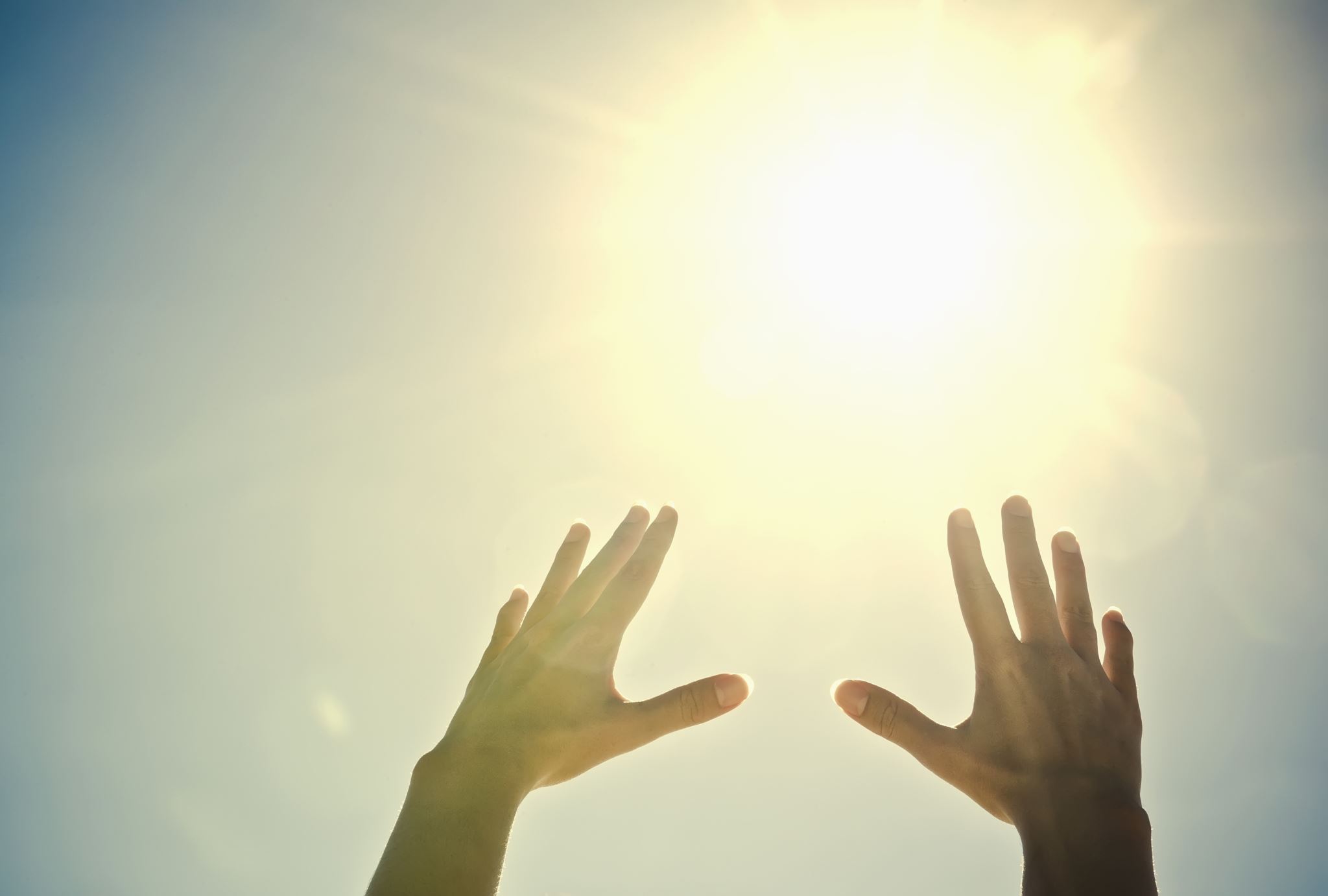 Hands-reaching-towards-the-sun